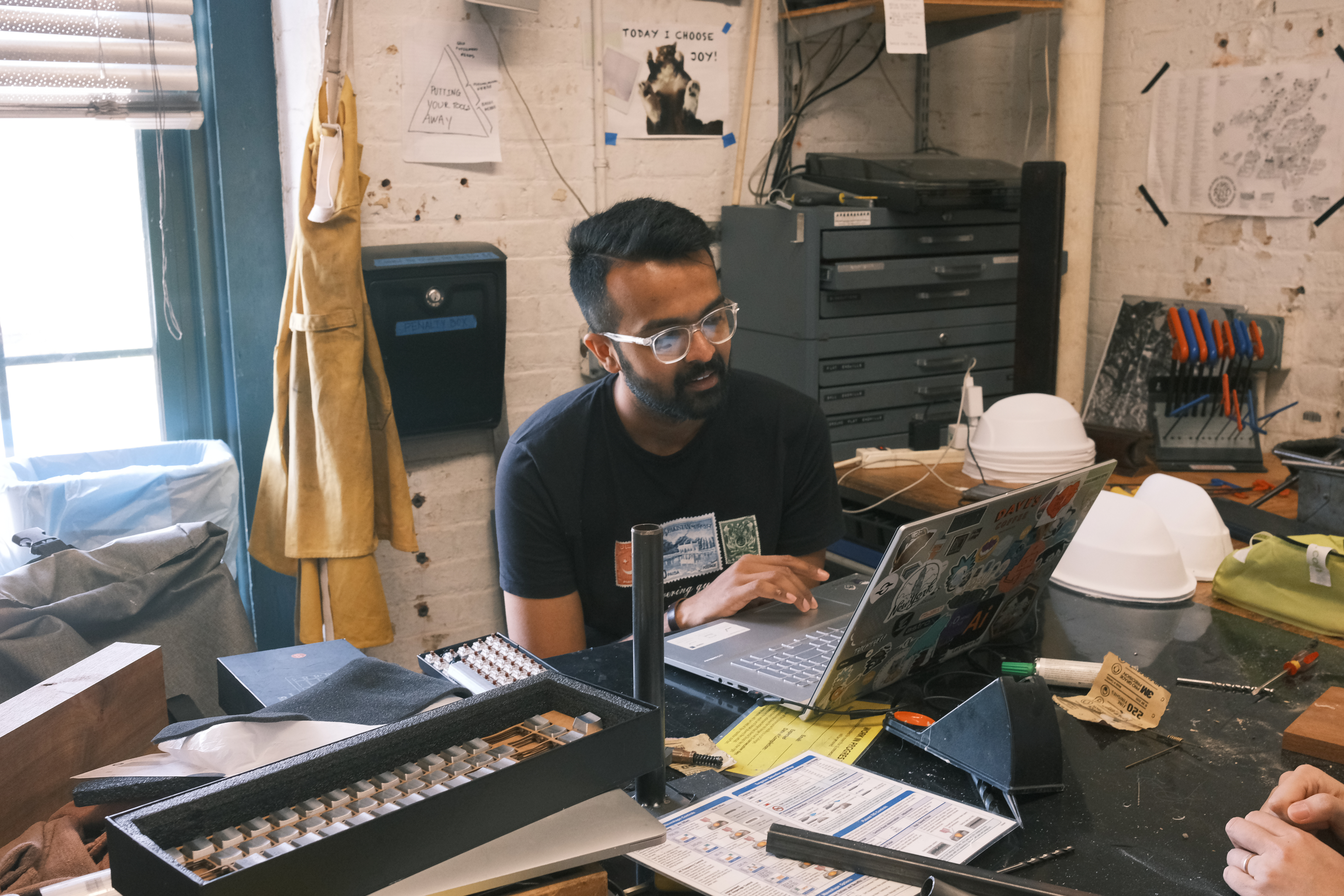Delicate flowers taped to a wall.